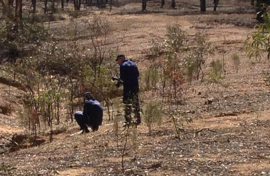 Investigators uncover the body of Samantha Kelly in bushland west of Bendigo, after she was murdered in a Kangaroo Flat bungalow in January last year.