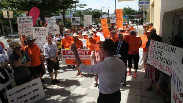 A section of the crowd of protesters demonstrating outside John Barilaro’s office on Friday. They called for an end to the state government’s unpopular amalgamation policy. 