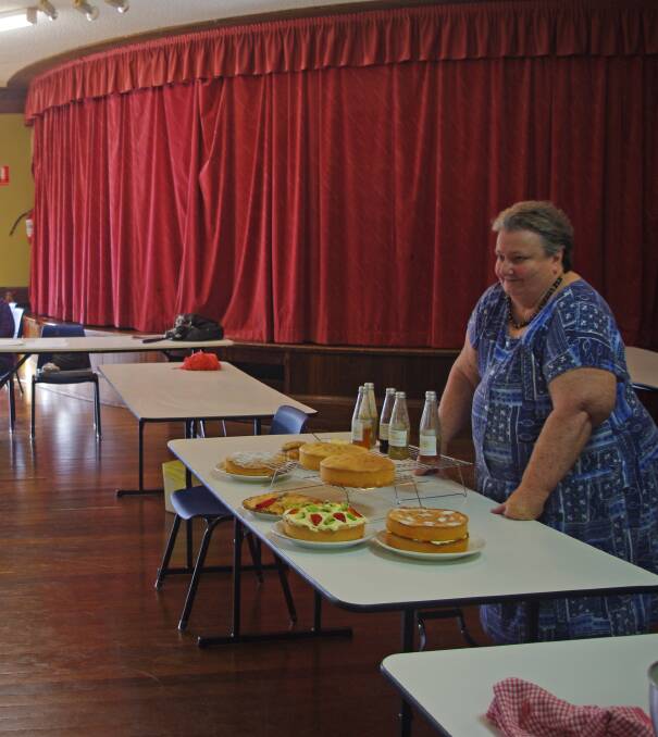 Boorowa CWA President Carmel Gordon leads the cooking class through a number of spongecake recipes. More than 20 people attended the class last week. 