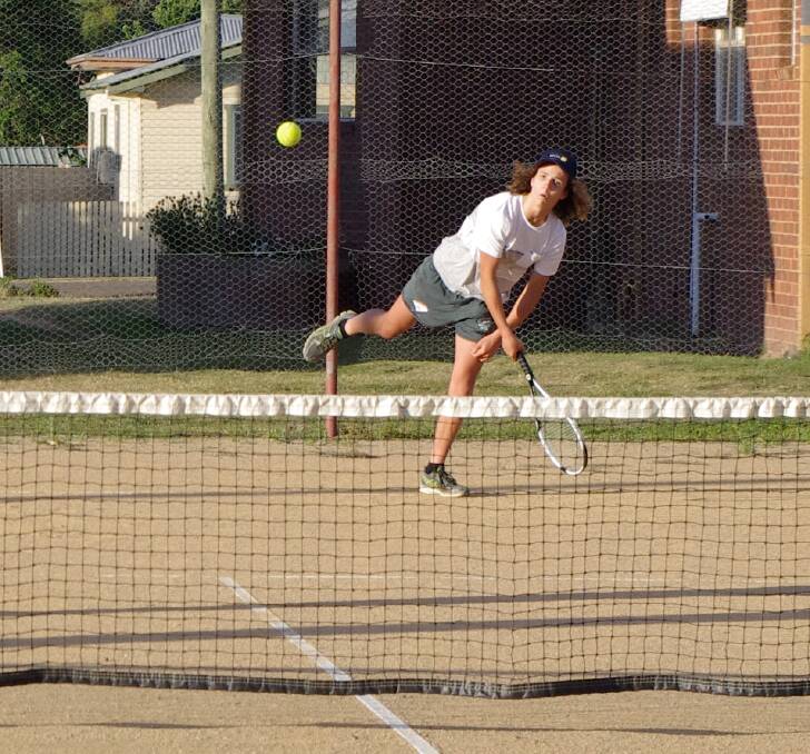 Isaac Clark serves during a game at the Boorowa Tennis Club. The club has received a $50,000 grant to build a new complex at the Boorowa Showground. 