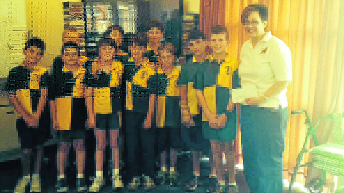 St Joseph's Primary School students presented $200 to Cecila Walsh at the Boorowa Hospital recently.
