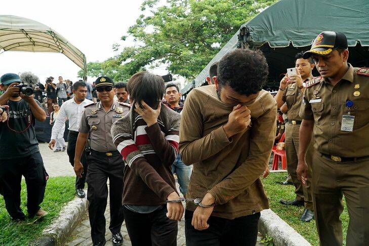 BANDA ACEH, INDONESIA - APRIL 18: Muhammad Taufik and Muhammad Habibi, both Acehnese men arrested for gay sex, arrived for being whipped in public for violating sharia law on May 23, 2017 in Banda Aceh, Indonesia. A sharia court on May 17 sentenced two men to be publicly caned for gay sex for the first time in Indonesia's conservative province of Aceh, the latest sign of a backlash against homosexuals in the Muslim-majority country. Two men received 85 lashes each.
 Jefri Tarigan