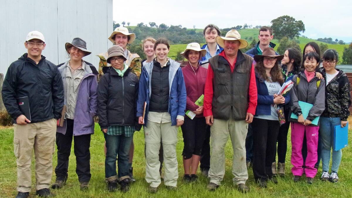 Roger Warren of "Cairns" with ANU students who mapped soils on his Boorowa farm.  
Back row from left: Decal Norrie, Brittany Dahl, Alexandra Mercer, Joseph Stapleton, Valeria Parisotto, Jiahui Luo. Front row from left: Zhaoyu Zang, Ellen Cheney, Kei Hatanaka, Lucy Hayes, Teagan Mahon, Roger Warren (owner of Cairns), Catlin O'Meara, Lin Xu, Sarah Cheng.