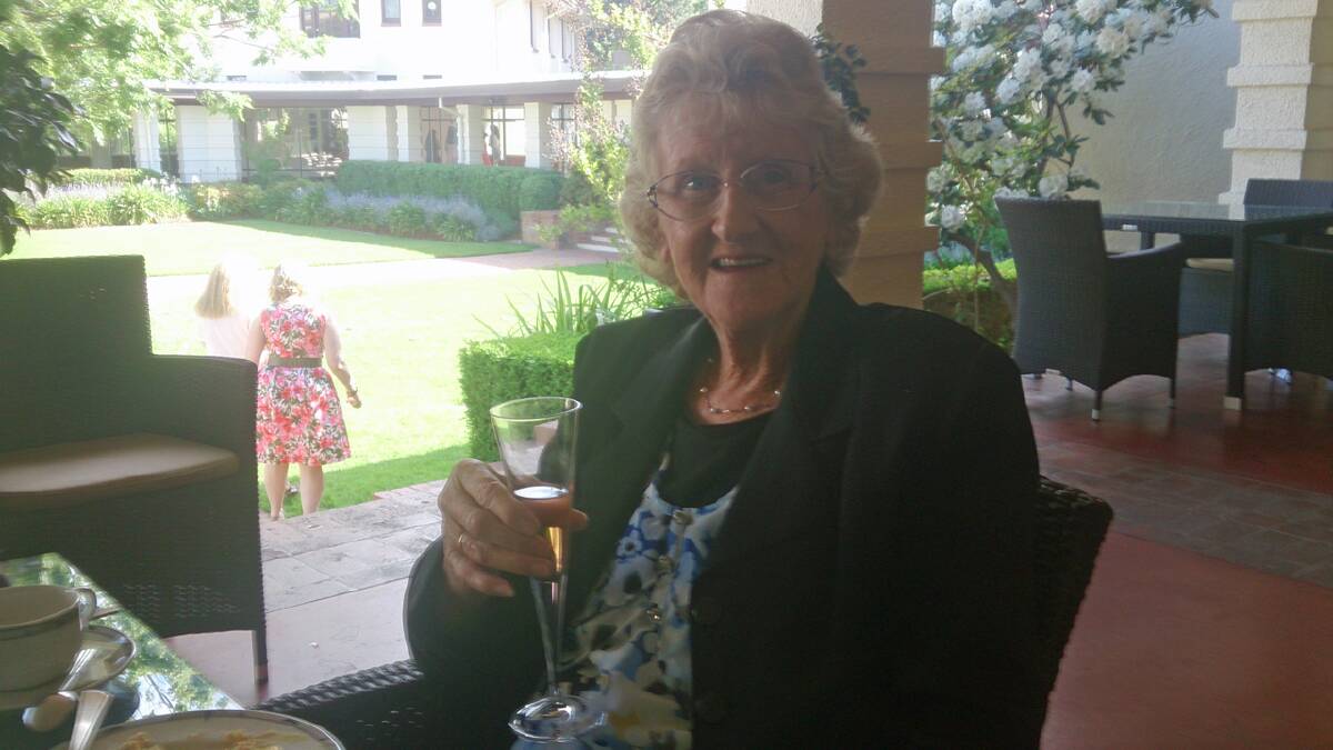Shirley Carmody toasting her 80th birthday.