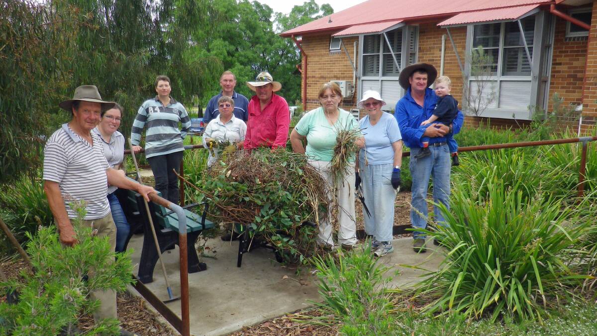 John Dymock, Melissa Henry, Lydia Jarvis, Roz and Rod Gibson, Roger Warren, Rosemary Nicholls, Jo Snelling, Steve and Peter Jarvis tidied up the Waterwise garden at the Boorowa Hospital recently.