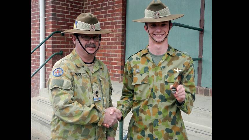 CDTWO1 Jordan Short-Hall (right) being congratulated by LTCOL (AAC) David Major the Commander from NSW Headquarters.