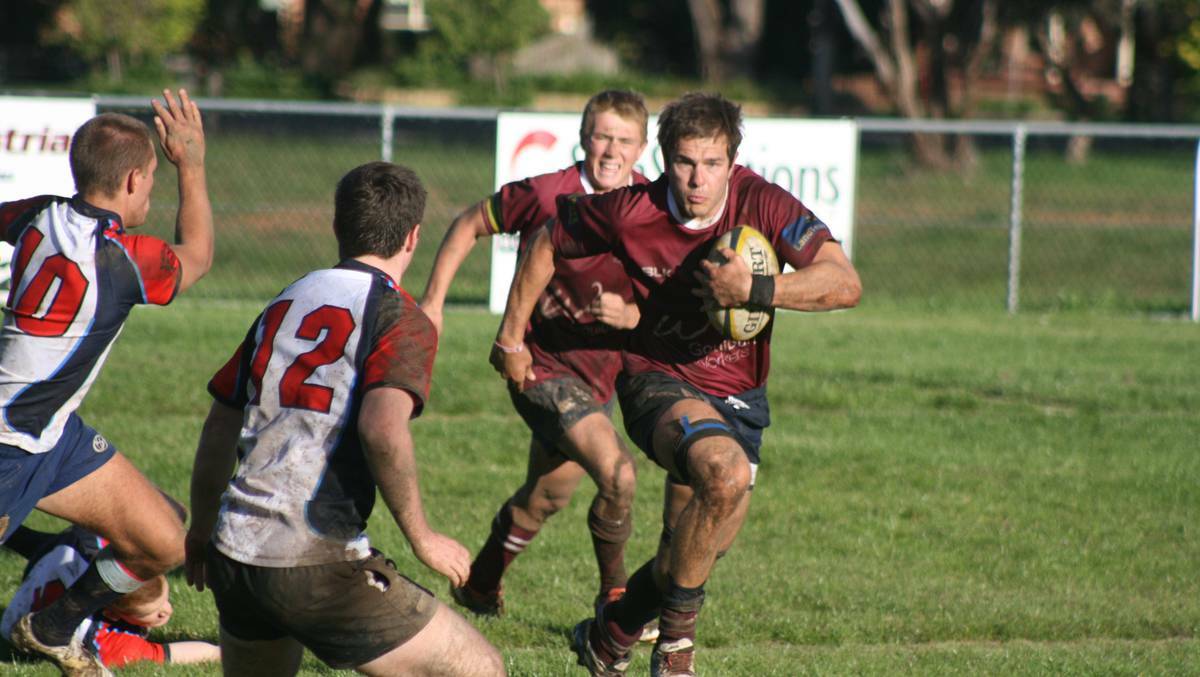 GOULBURN: The Goulburn Dirty Reds opened their 2014 account with wins on both Saturday and Sunday in both first and reserve grades. Number 8 Mik Webber is pictured taking the attack to the Defence Academy. Photo Chris Gordon, GOULBURN POST.