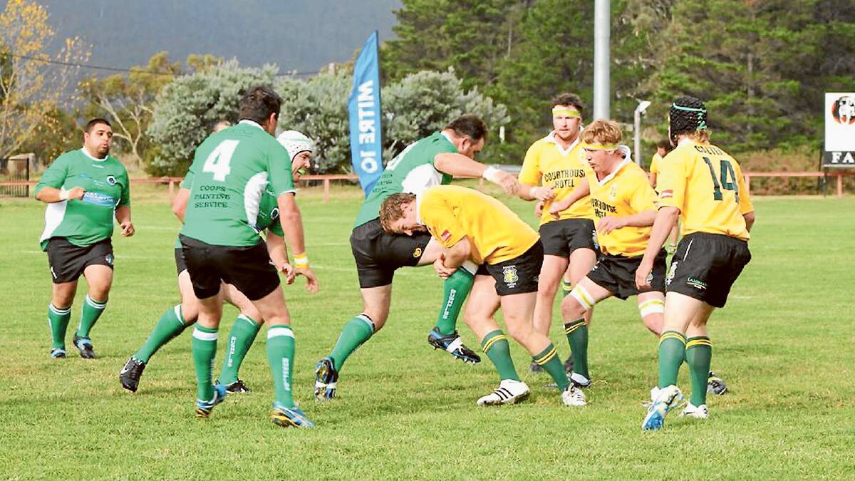 A Boorowa Goldies player taking on a Jindabyne opponent in years past. FILE PHOTO.