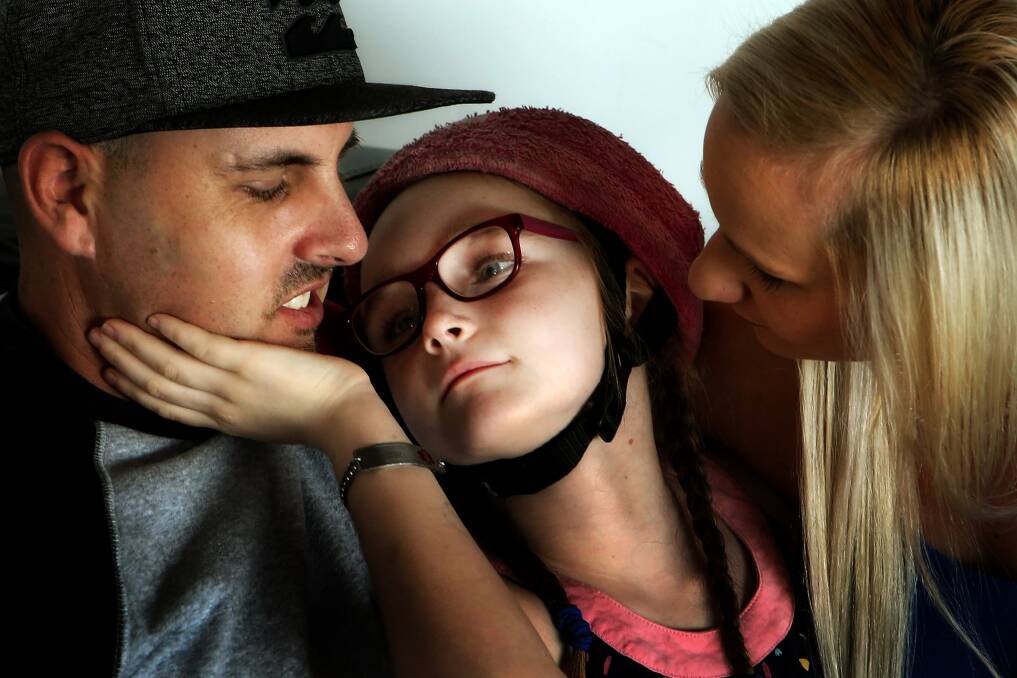 Lake Heights parents Yvonne Cooper and Daniel Phelps want legal access to medicinal cannabis for their daughter Sienna, 8. Picture: Sylvia Liber