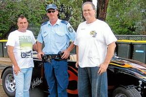 Steve Penrose, local police officer Randall O'Brien and Rick Saxon of the Lions Club. Mr Penrose and Mr Saxon are the Show and Shine event's original organisers.