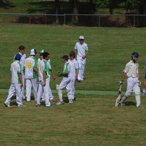 The Boorowa Under 17’s Cricket side discuss tactics during a break of play.