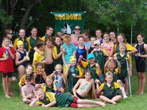 The Boorowa Swimming Club show off the numerous ribbons they won competing against teams from the South West Zone on Sunday.