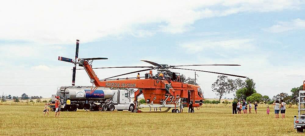 HERE TO HELP: Air Crane "Camille", at Boorowa Showground, arrived on Saturday to aid firefighting efforts.