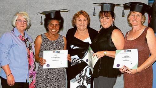 Graduates Diploma of Children's Services: L to R: Head Teacher of Children's Services Mary Heys, graduate Claudina McPhillips, TAFE Institute Director Dianne Murray, graduate Cindy Davis, graduate Leanne Wilcox - these students completed the diploma flexibly through Shellharbour campus but with local support from Mary Heys.