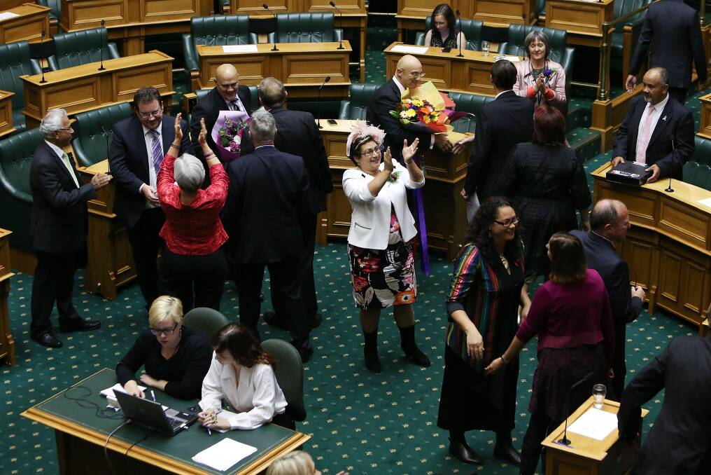 MPs celebrate in the House after the third reading and vote on the Marriage Equality Bill at Parliament House on April 17, 2013 in Wellington, New Zealand. Photo: Getty Images