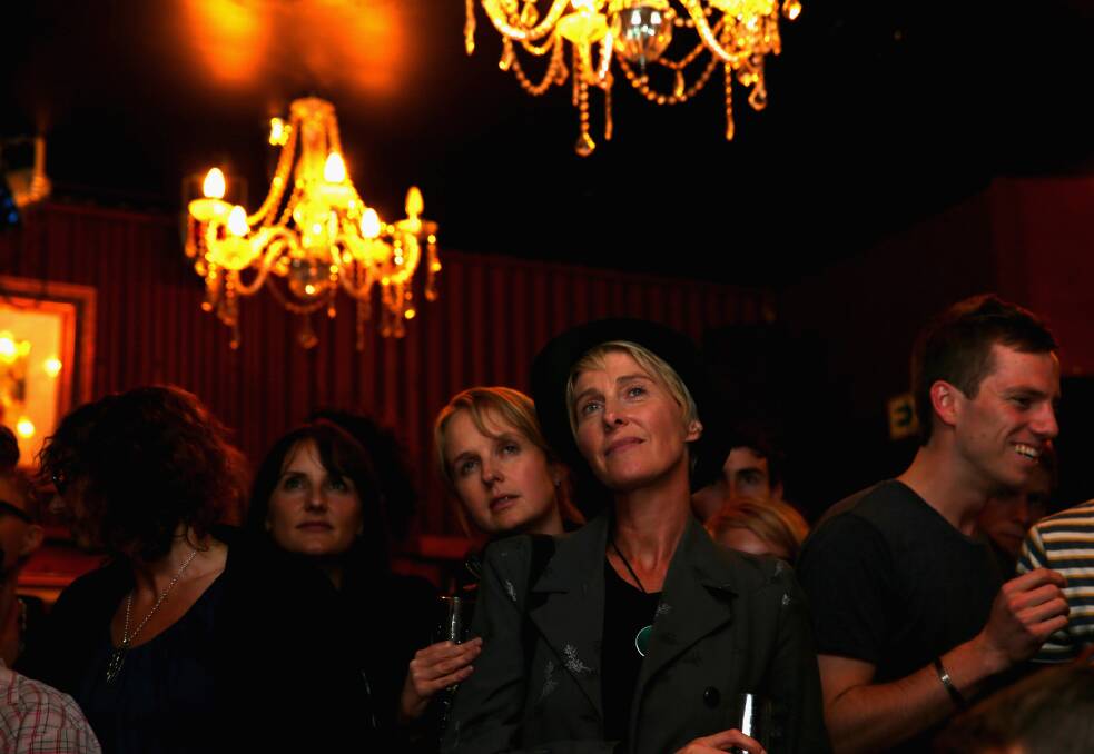 People watch the final reading on Parliament TV at the Caluzzi Bar and Cabaret venue as New Zealand MP's gathered today to vote on the gay marriage bill. Photo: Getty Images