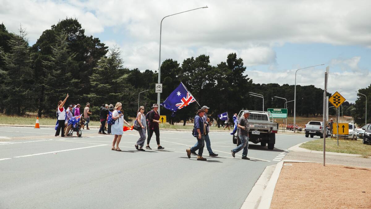 Anti-vax protesters slow traffic on Cotter Road, near Government House, on Monday. Picture: Dion Georgopoulos