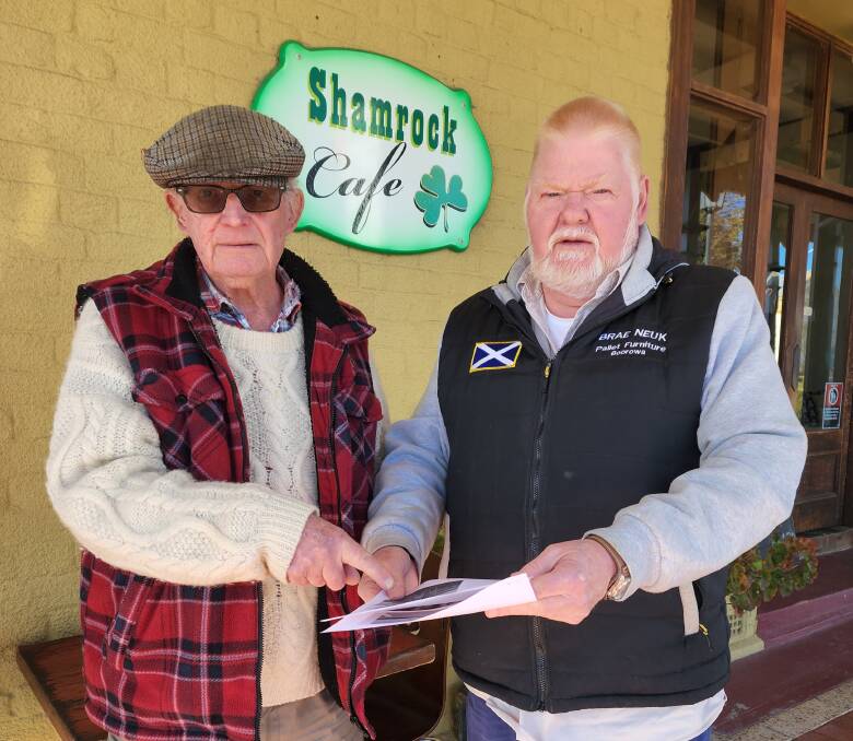 Boorowa resident, John Snelling, and Boorowa Business Chamber President, Angus Mitchell, read through the Transport Management Plan that details major modifications to Boorowa's main street to allow wind farm components to be transported from Port Kembla to Blayney. 