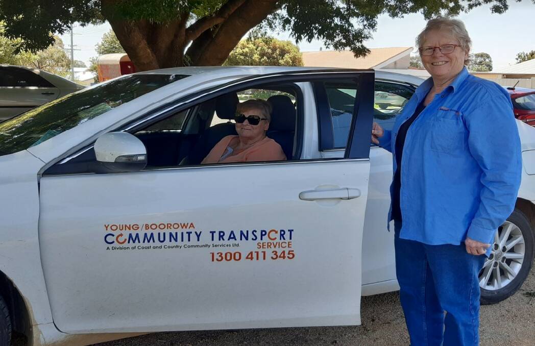 Carmel Tesoriero sitting in the community transport vehicle with driver Jenny Twarloh