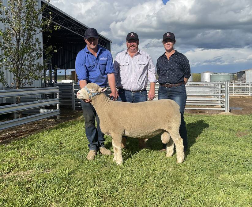 Dane Rowley, Springwaters Poll Dorset stud, Boorowa, with the $20,000 sire purchased by Kyle and Lisa Sturgess, Redline Poll Dorset stud, West Wyalong. 