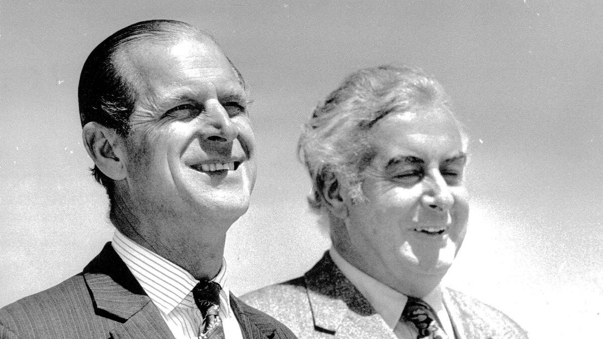 Prince Philip, the Duke of Edinburgh, arrives in Canberra on October 14, 1973, where he was met at the Fairbairn RAAF base by Prime Minister Gough Whitlam, right. Picture: Peter Ford