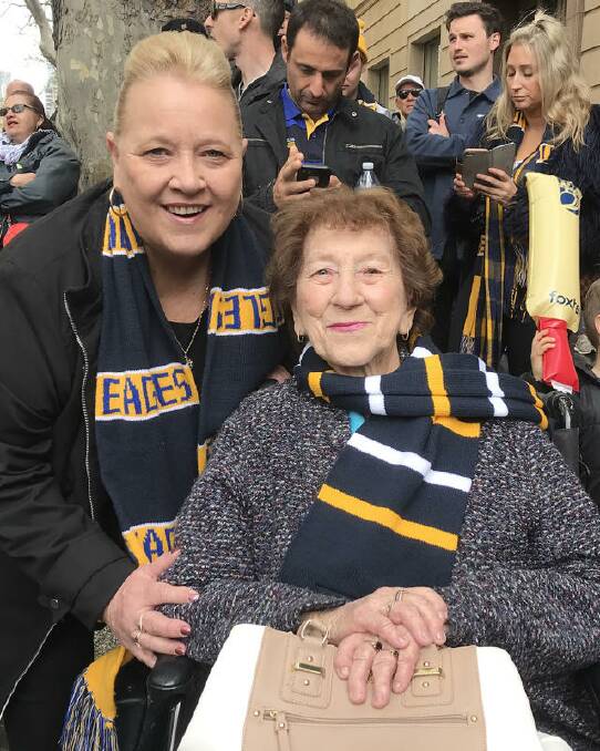 Cheryl Dragowski and her mother Sylvia Prince, 85, at the AFL Grand Final Parade. Photo: AAP Image/Amber Wilson