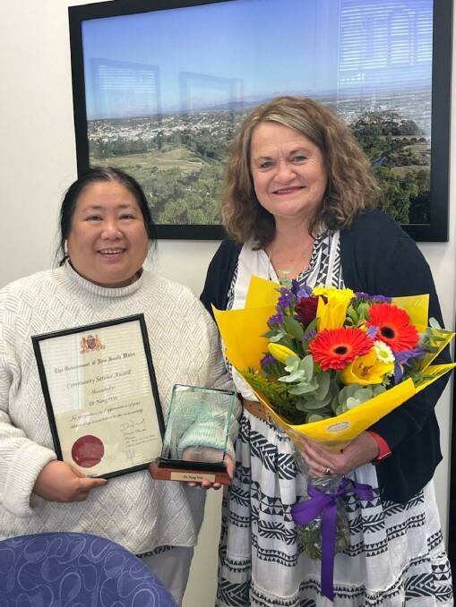 Member for Goulburn, Wendy Tuckerman presenting Dr Nang Win with a Premier's Award. 