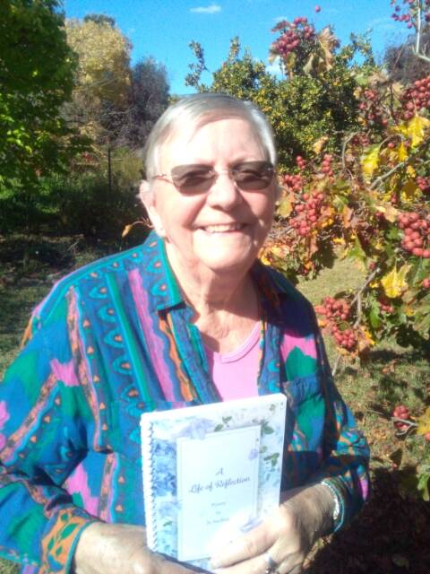 Jo Snelling with her book in her beloved garden. Jo sadly passed away suddenly last week. Her funeral will be held in Canberra on Tuesday June 21.