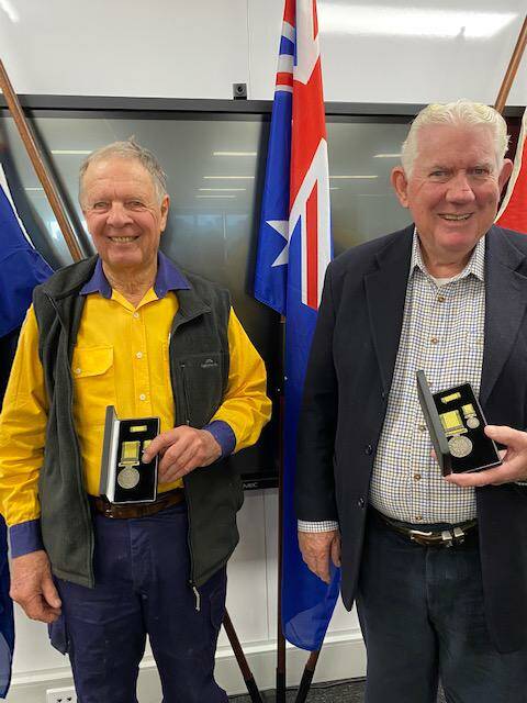 John Dymock and John Piper with their service awards. Photo contributed.