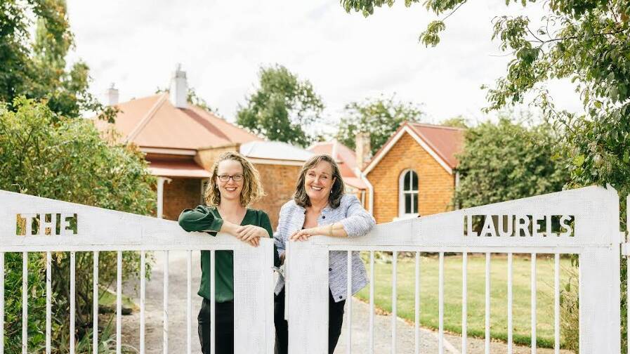 Jayne and Carmel at the gates of 'The Laurels' where they hosted a Biggest Morning Tea on May 21.