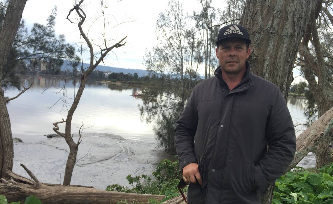 RESCUE: Justin Smith paddled a canoe across the flooded Shoalhaven River to PIg Island to look for his mate Michael Dadd, who after hours of fruitless searching he thought "was gone".