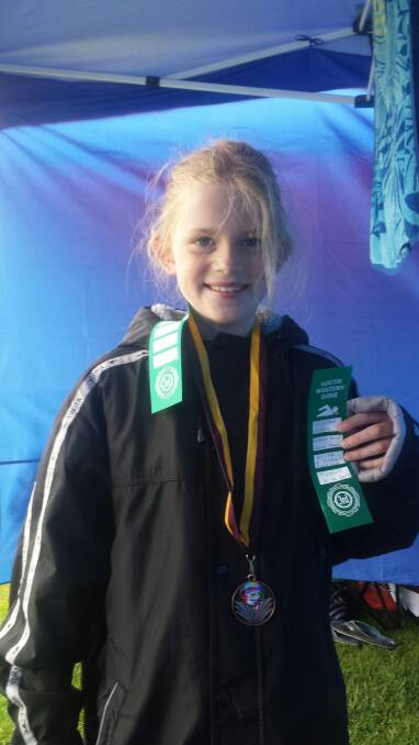 Kirsten Piper worked hard and gained a bronze medal in the Under 8 breast stroke.