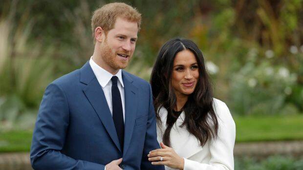 Britain's Prince Harry and his fiancee Meghan Markle pose for photographers in the grounds of Kensington Palace. Photo: AP