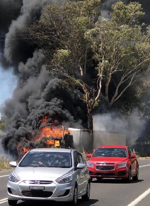 The truck which crashed into a tree and caught on fire on the Lachlan Valley way, 10kms south of Cowra, on Sunday afternoon. Photo supplied. 