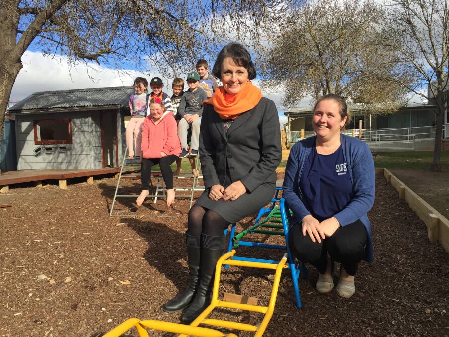 Member for Goulburn, Pru Goward (centre) with BEE Centre Director Sheree Shoring (right) and children from the centre. 