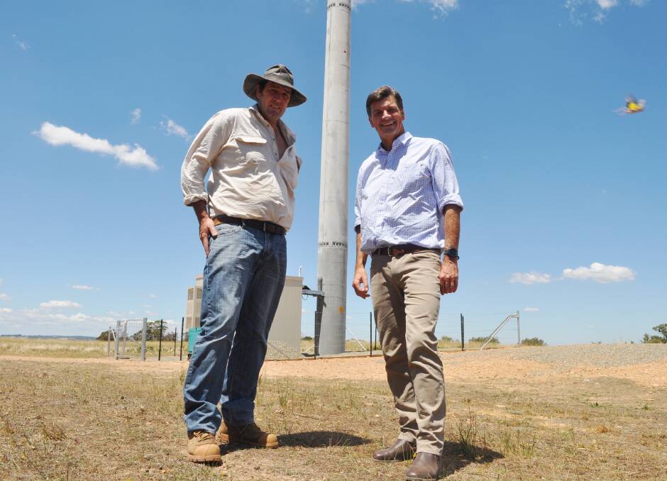 Angus with Lost River farmer John McCormack and the new Lost River mobile phone tower. 