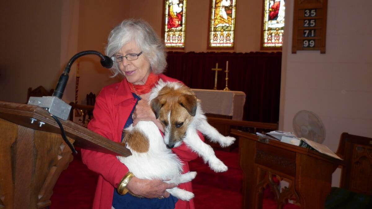 Lay minister Bimbi Turner conducting the Blessing of the Animals in St Johns Church on Sunday morning. Her dog Tommy seems somewhat oblivious of the significance of the occasion.