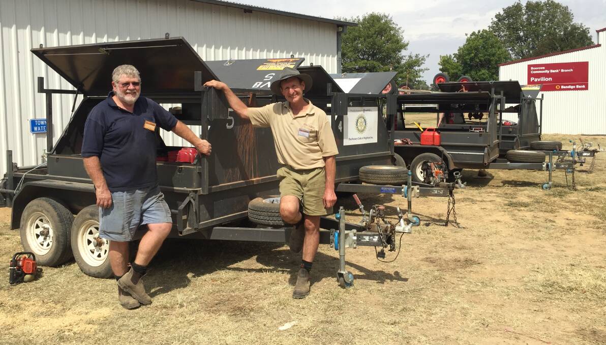 Volunteers David Staniforth (Orange) and Bruce Gruber (Queanbeyan) are just two of the volunteers that will help out farmers in the Boorowa region. Photo: Kelsey Sutor