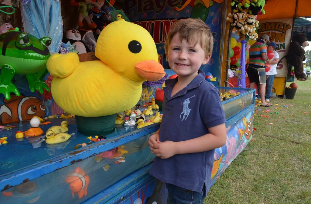 Jock Bowman has a go at fishing for rubber ducks, toy fish and swans at a game in the sideshow alley at the 2017 Boorowa Show.

