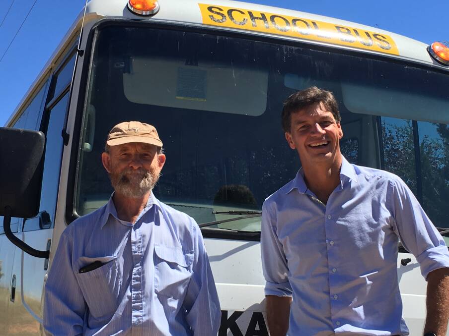 Local school bus driver Graham Jenkins (pictured with Member for Hume Angus Taylor_ says his internet speeds under the NBN have doubled. 