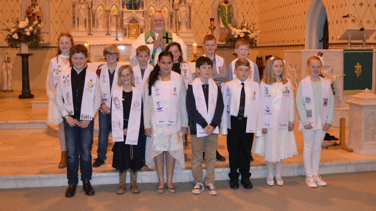 13 children from St. Patrick’s Parish were joined by their family, friends and the parishioners to celebrate their First Holy Communion on August 5. 