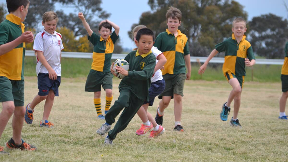St Joseph's student Lachlan Li breaks through the Boorowa Central School defence at the carnival a few years ago. 