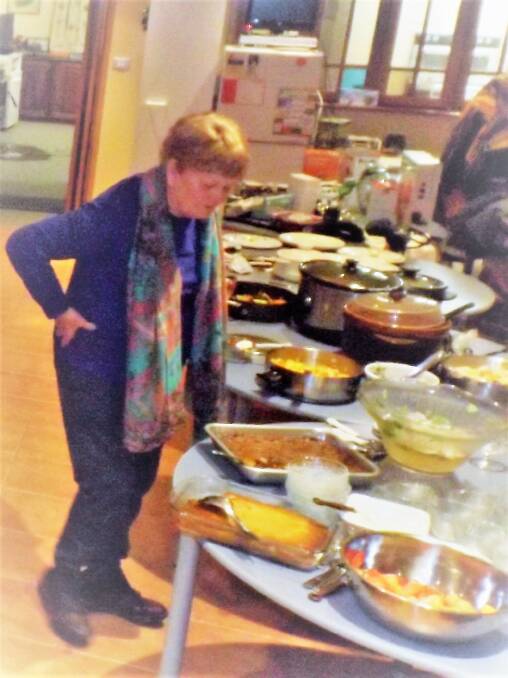 Boorowa Lions Club Welfare Officer Anne Liddle deciding on meals. 