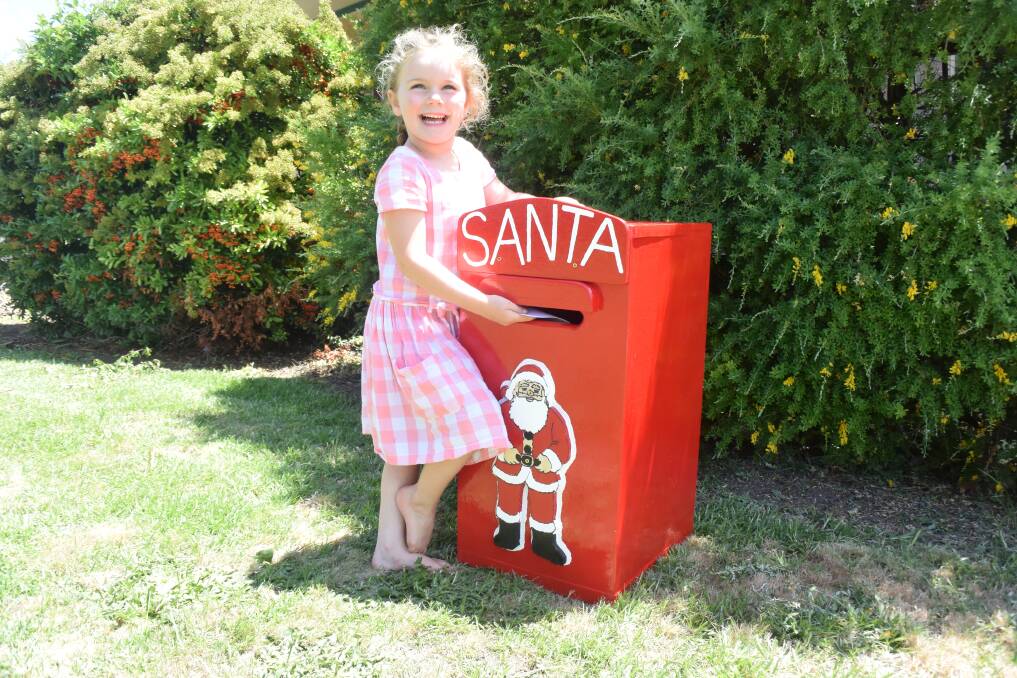 Maya Hewitt is very excited to post her letter to Santa this year with the big, red letterbox located at Boorowa Police Station, thanks to the Boorowa Men's Den. 