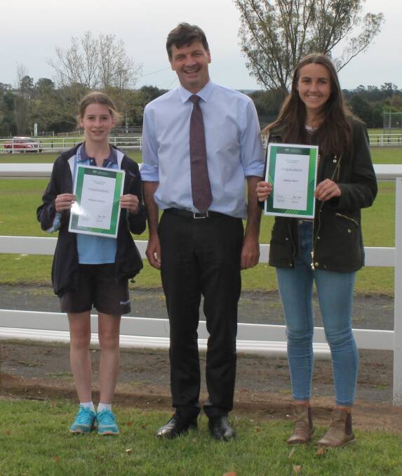  Federal Member for Hume Angus Taylor with Bethany Jenkins (Narellan Vale) and Matilda Offord (Cobbitty) who were among the many young people in the electorate to receive a Local Sporting Champions grant.