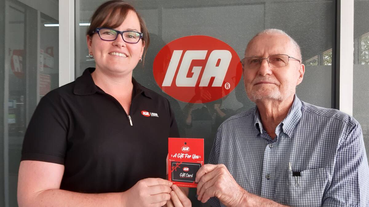 Jamie-Lee Bush of Boorowa IGA and Derrick Mason of the local Can Assist committee. The raffle will be drawn at the Songs of Hope concert on April 19.