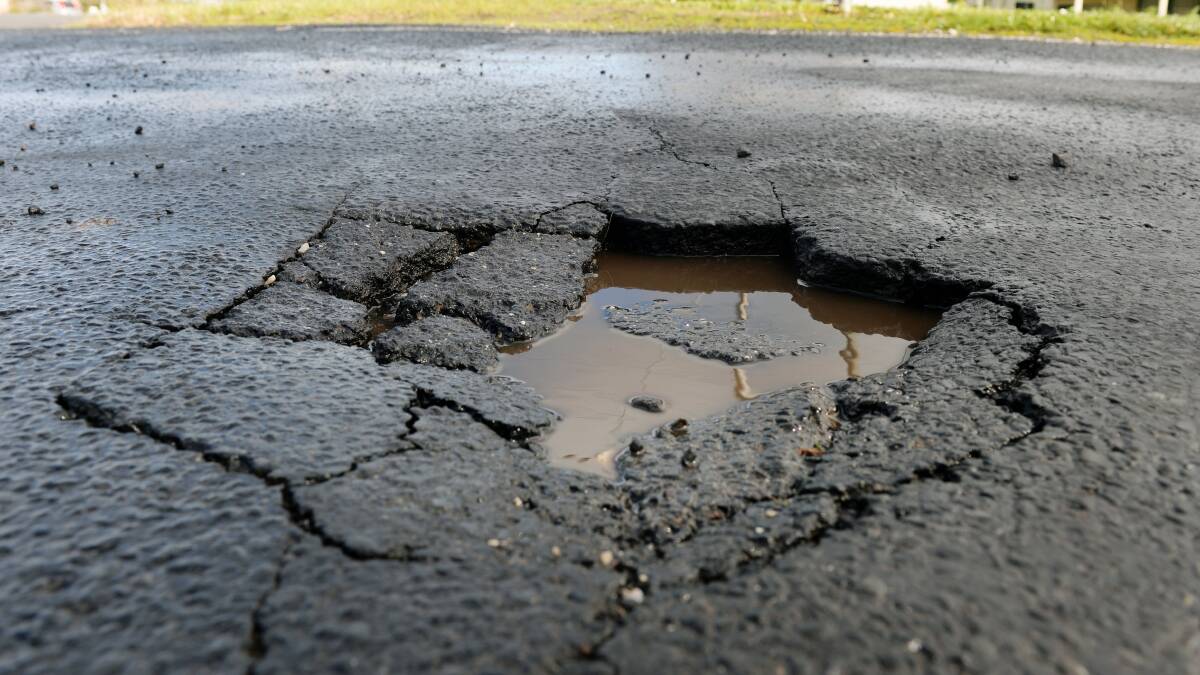 Poor maintenance: rain is not the cause of potholes, says a senior engineer, but rather bad preparation of roads. Photo: Kate Healy.
