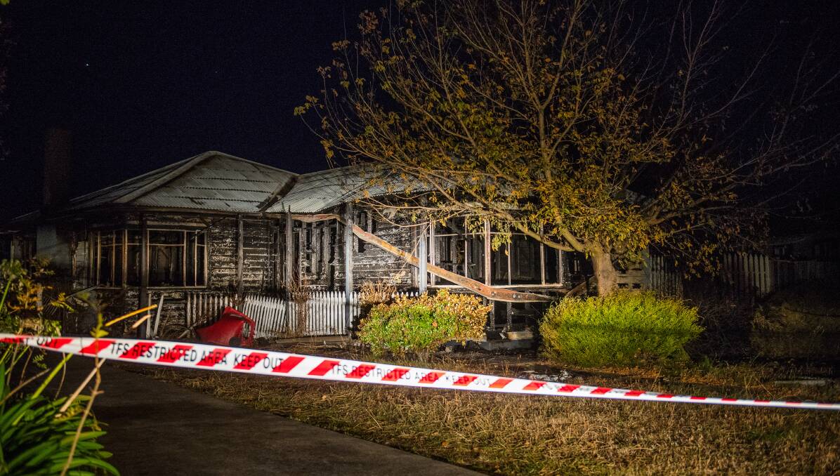 Arson: The house on Mitchell Street, Mayfield, which is at the centre of an alleged murder investigation, was extensively damaged by a fire on Sunday. Picture: Scott Gelston