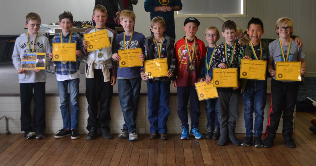 The under 10's team receives their awards.