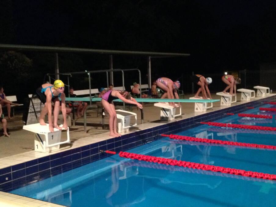  Swimmers line up ready for their Shine Shield race on Saturday night.